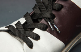 Шнурок з логотипом на кінцівці